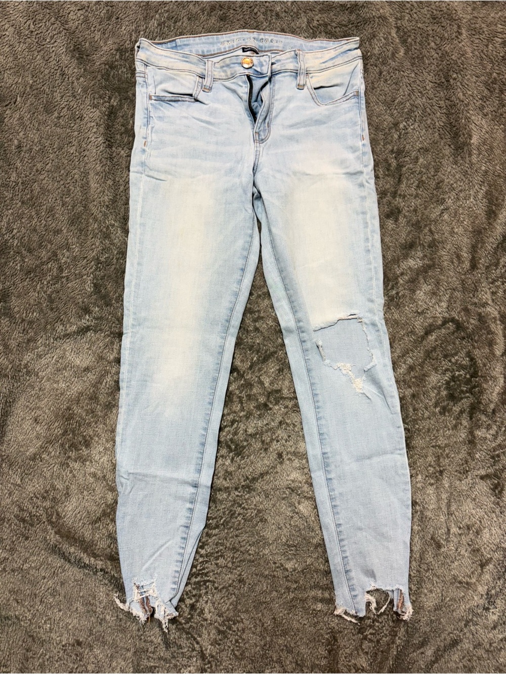 American Eagle Outfitters Light Blue Skinny Jeans with Distressed Hem